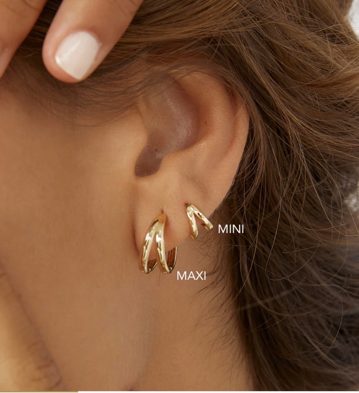 jean huggie earrings arms of eve