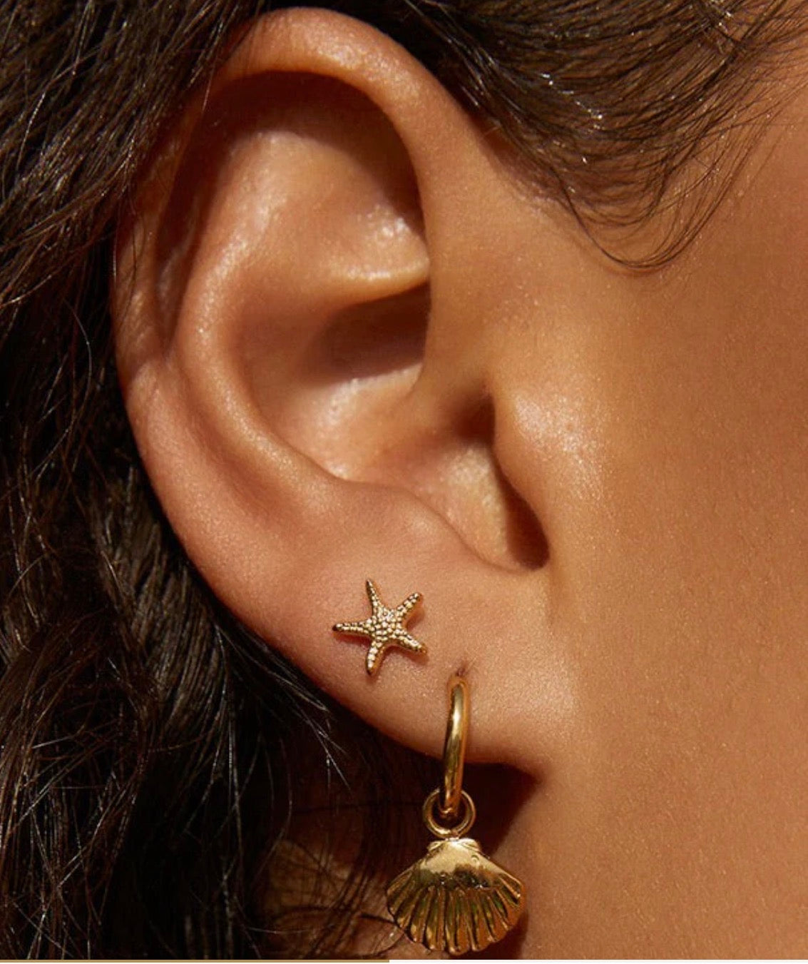 shelli gold earrings arms of eve