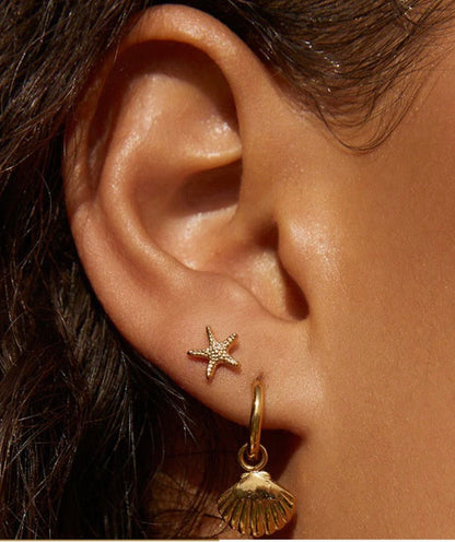 shelli gold earrings arms of eve